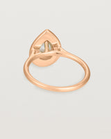 Back view pear halo ring featuring a pear cut clear laboratory grown diamond and a halo of white diamonds in rose gold
