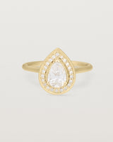 Front view pear halo ring featuring a pear cut clear laboratory grown diamond and a halo of white diamonds in yellow gold