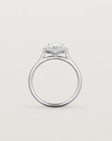 Standing view pear halo ring featuring a pear cut clear laboratory grown diamond and a halo of white diamonds in white gold