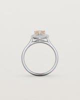 Standing view pear halo ring featuring a pear cut rutilated quartz stone and a halo of white diamonds in white gold