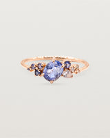 Blue sapphire cluster featuring oval and round sapphires, crafted in rose gold