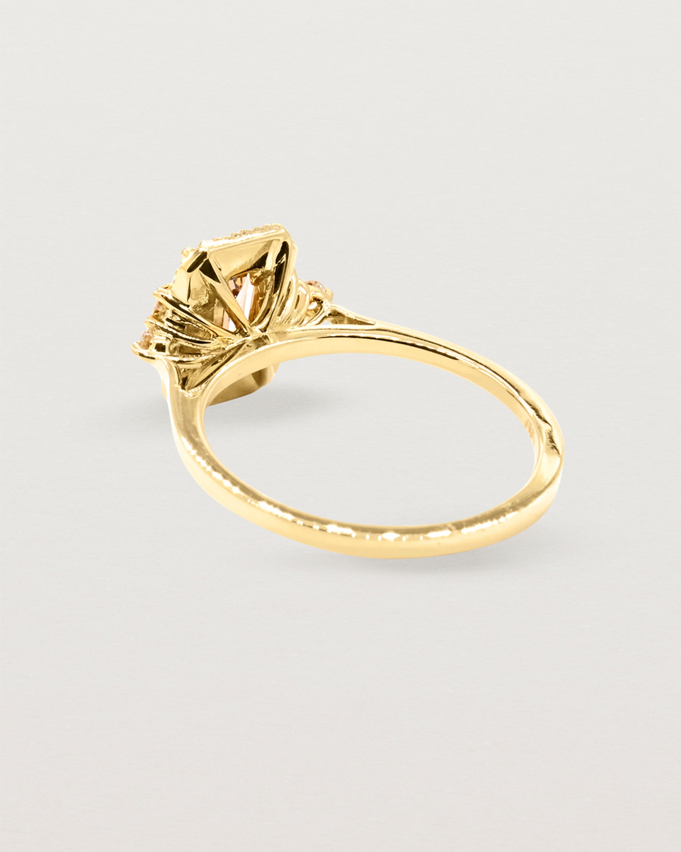 Back view of a yellow gold halo ring