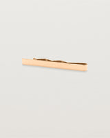 A rose gold rectangular tie bars