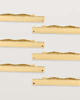 Five yellow gold rectangular tie bars