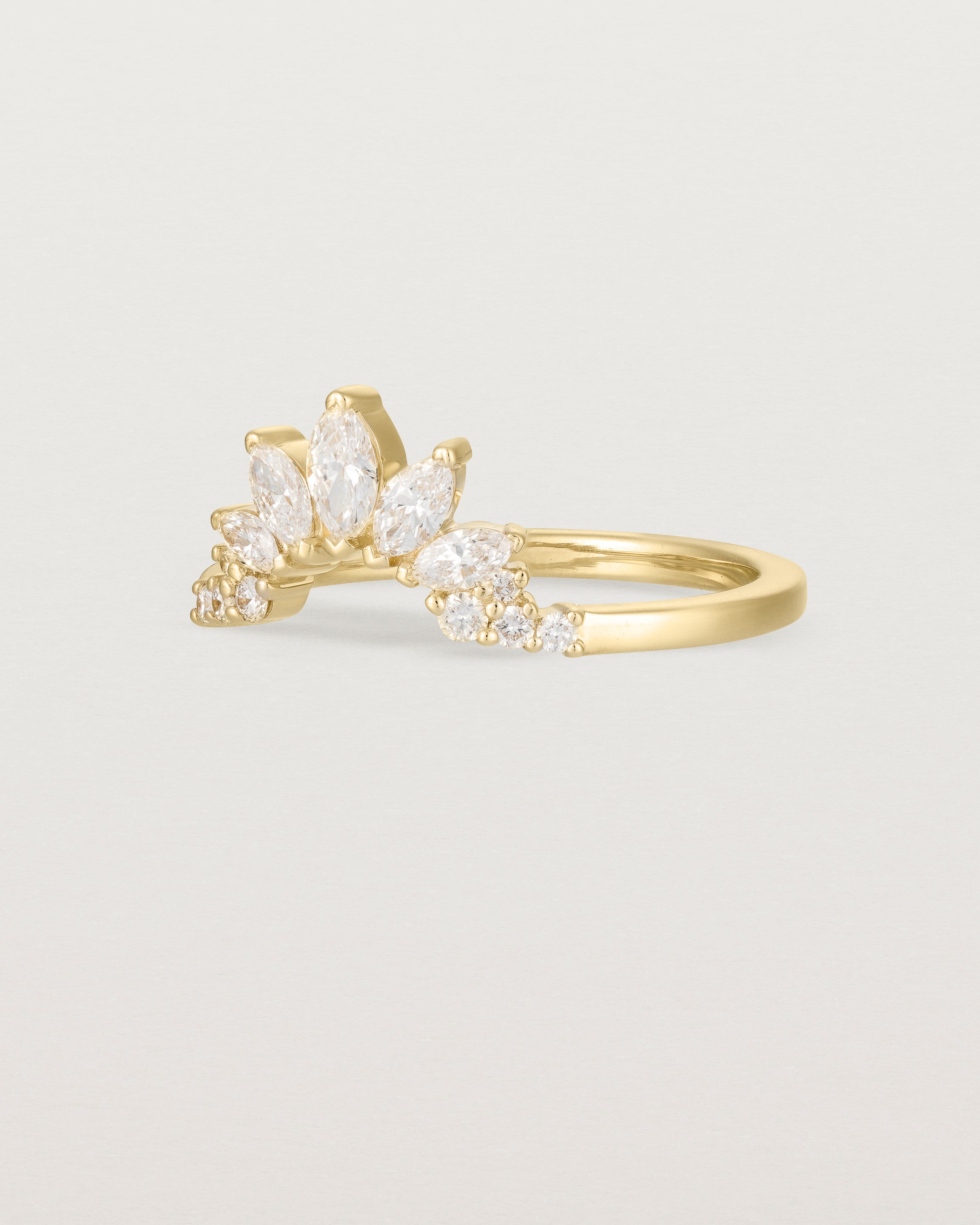 Size three of a sun-bream inspired white diamond crown ring, crafted in yellow gold