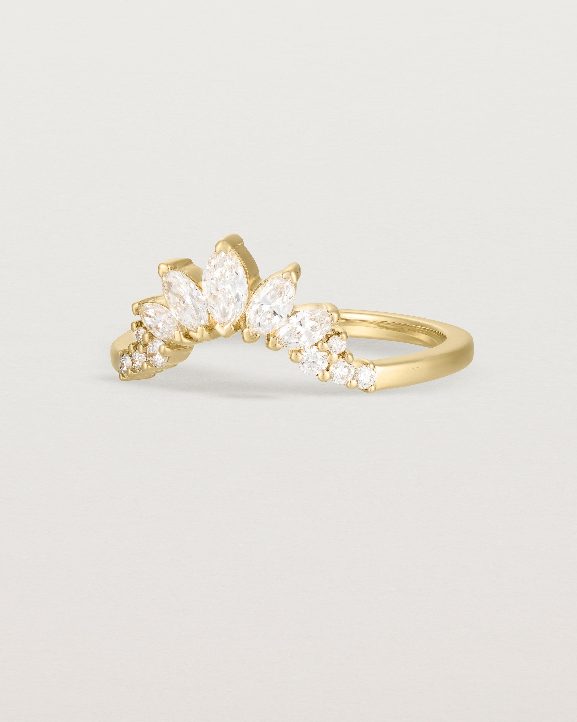 Size four of a sun-bream inspired white diamond crown ring, crafted in yellow gold