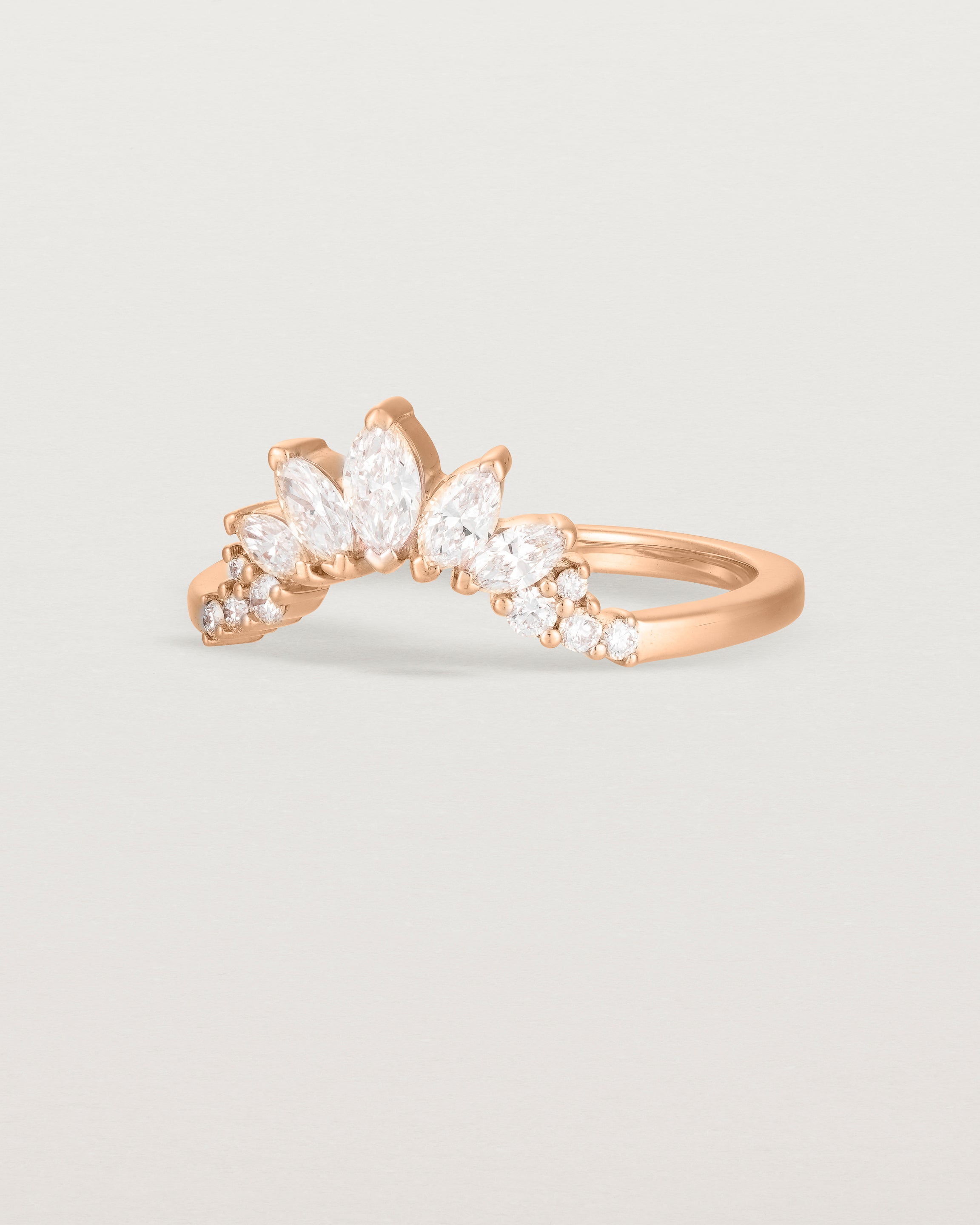 Size four of a sun-bream inspired white diamond crown ring, crafted in rose gold