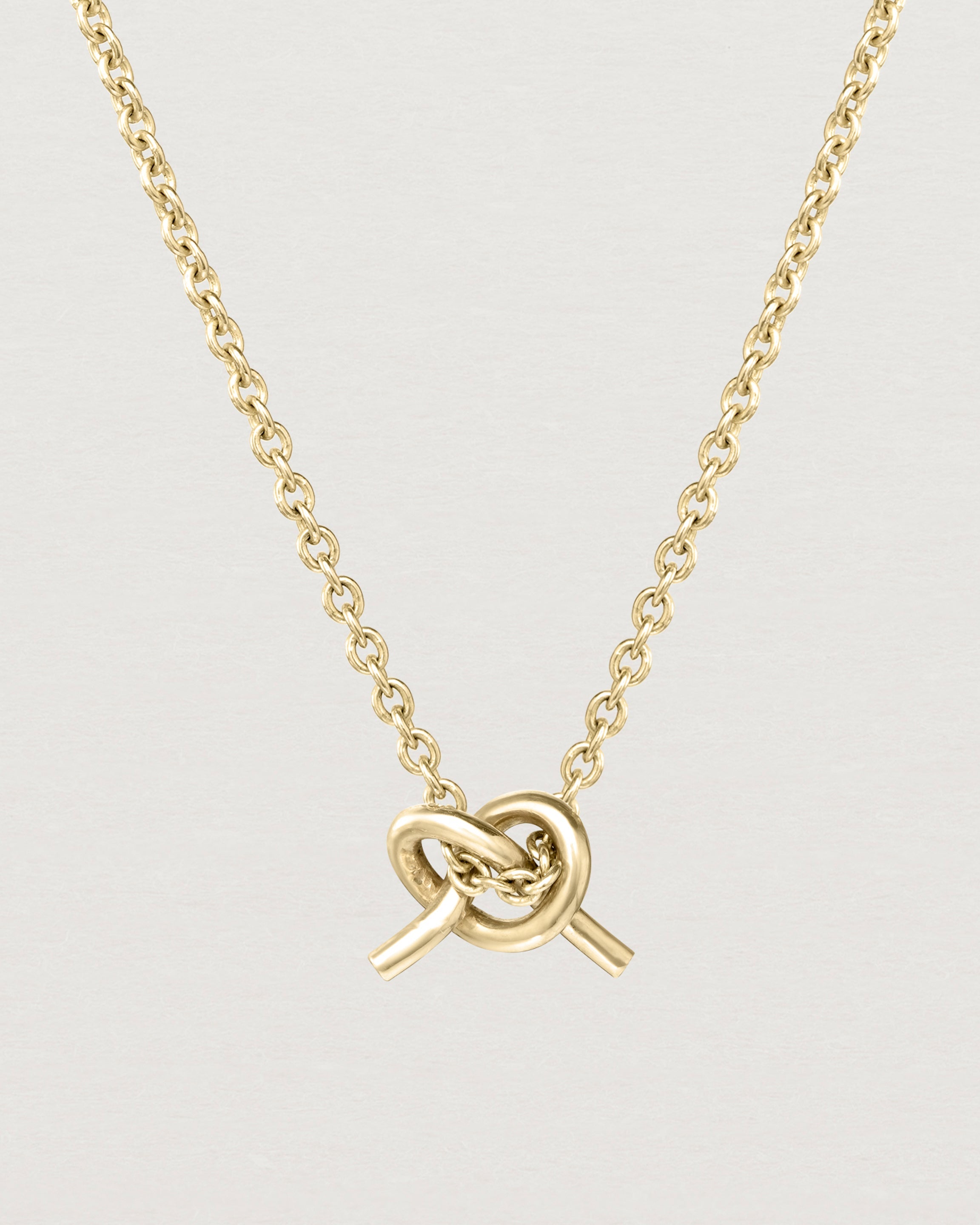 Front view of the Cara Necklace in yellow gold.
