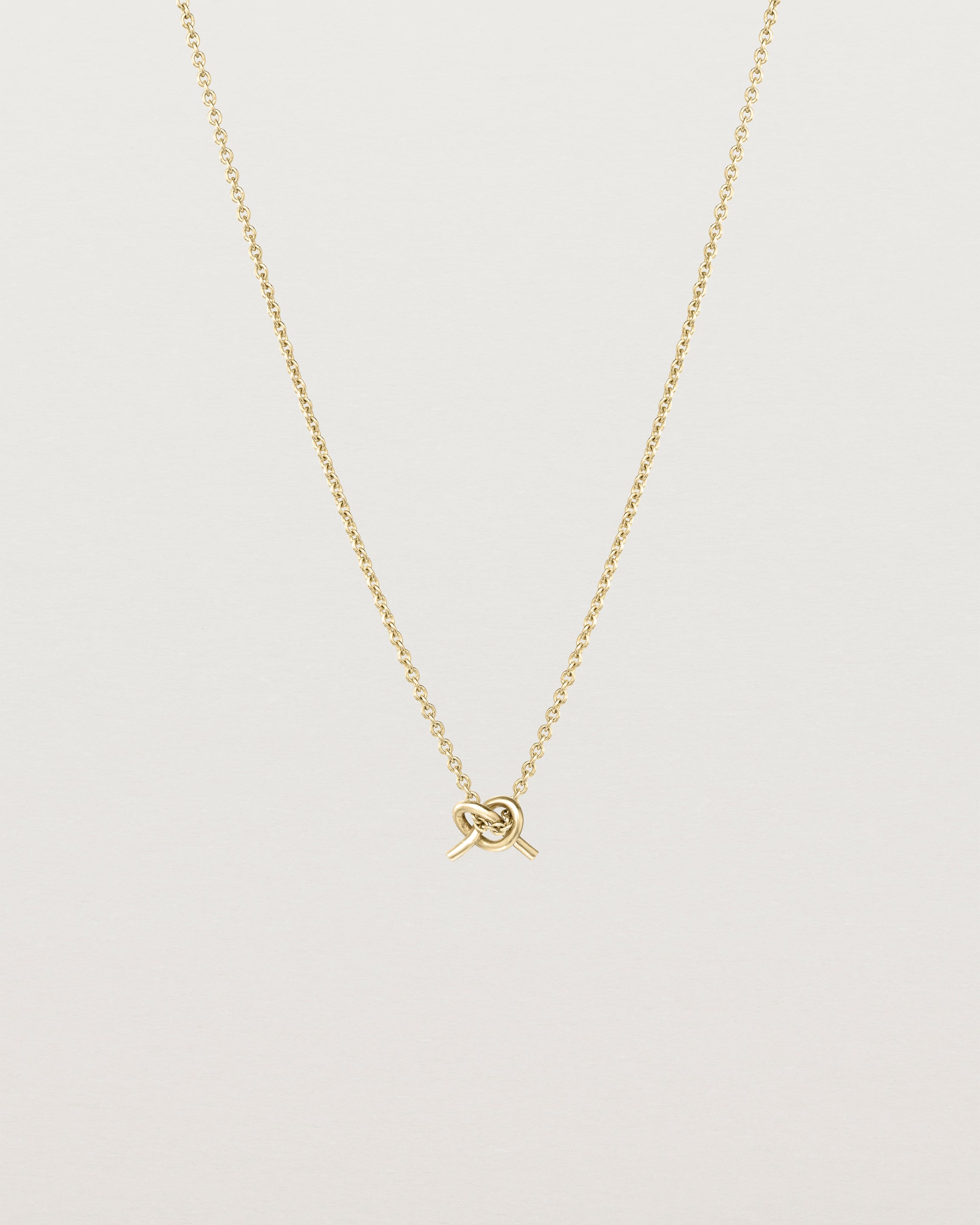 Front view of the Cara Necklace in yellow gold.