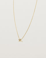 Angled view of the Cara Necklace in yellow gold.