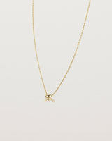 Angled view of the Cara Necklace in yellow gold.