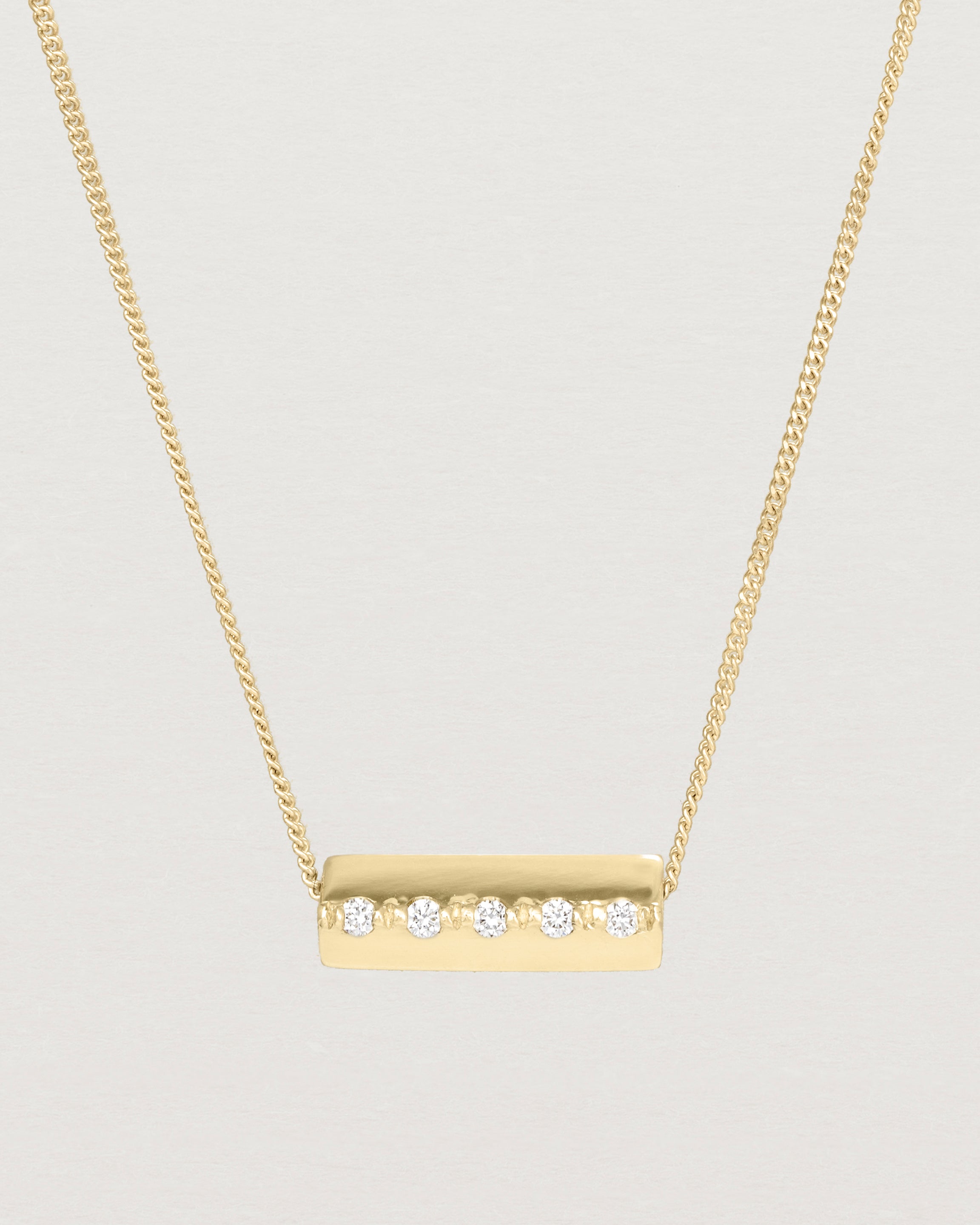 Close up view of the Cascade Knife Edge Necklace | Diamonds in yellow gold.