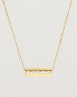 Close up view of the Cascade Knife Edge Necklace | Diamonds in yellow gold.