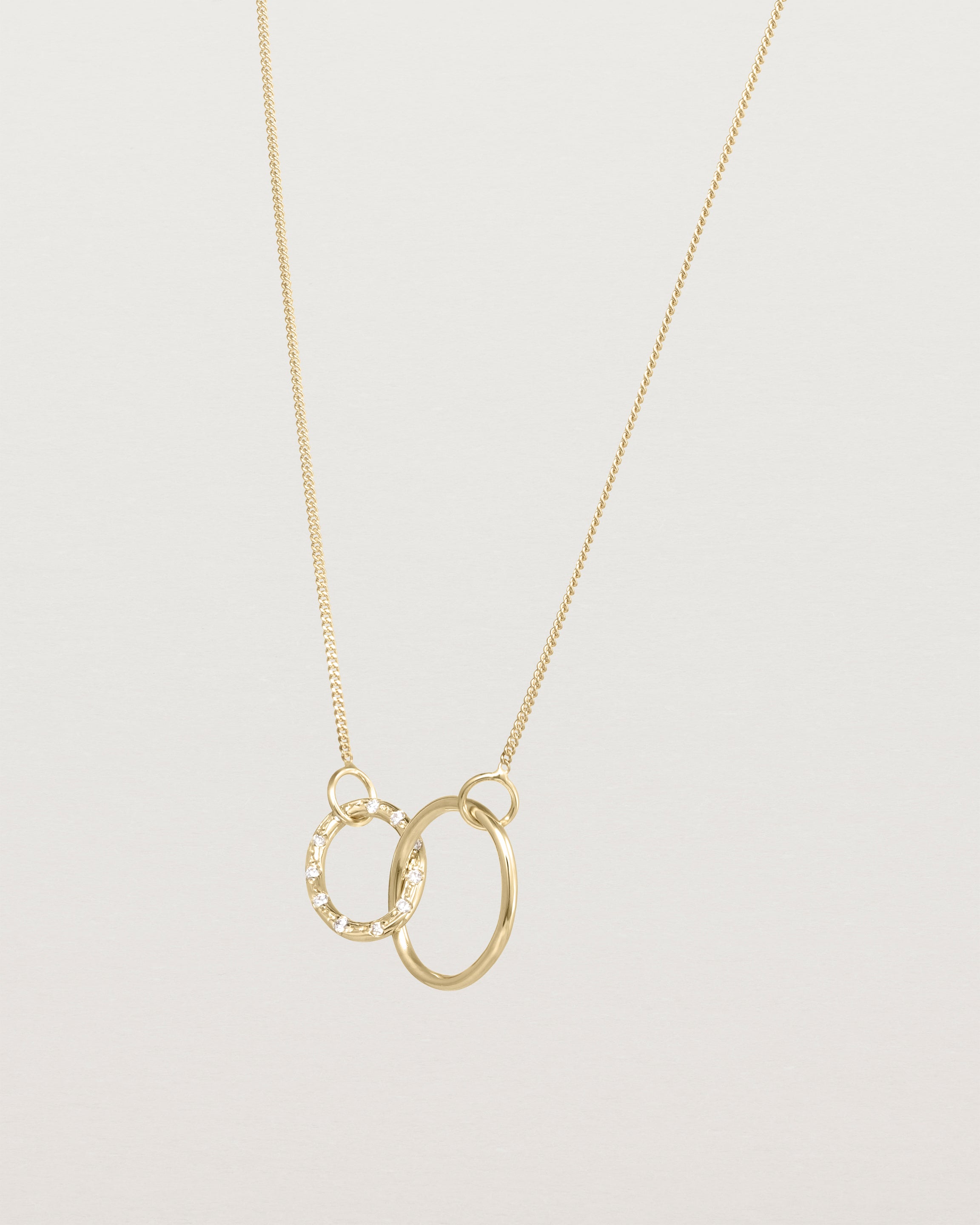 Angled view of the Cascade Loop Through Oval Necklace | Diamonds | Yellow Gold