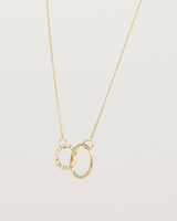 Angled view of the Cascade Loop Through Oval Necklace | Diamonds | Yellow Gold