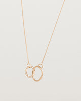 Angled view of the Cascade Loop Through Oval Necklace | Diamonds | Rose Gold