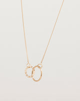 Angled view of the Cascade Loop Through Oval Necklace | Diamonds | Rose Gold