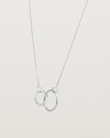 Angled view of the Cascade Loop Through Oval Necklace | Diamonds | White Gold