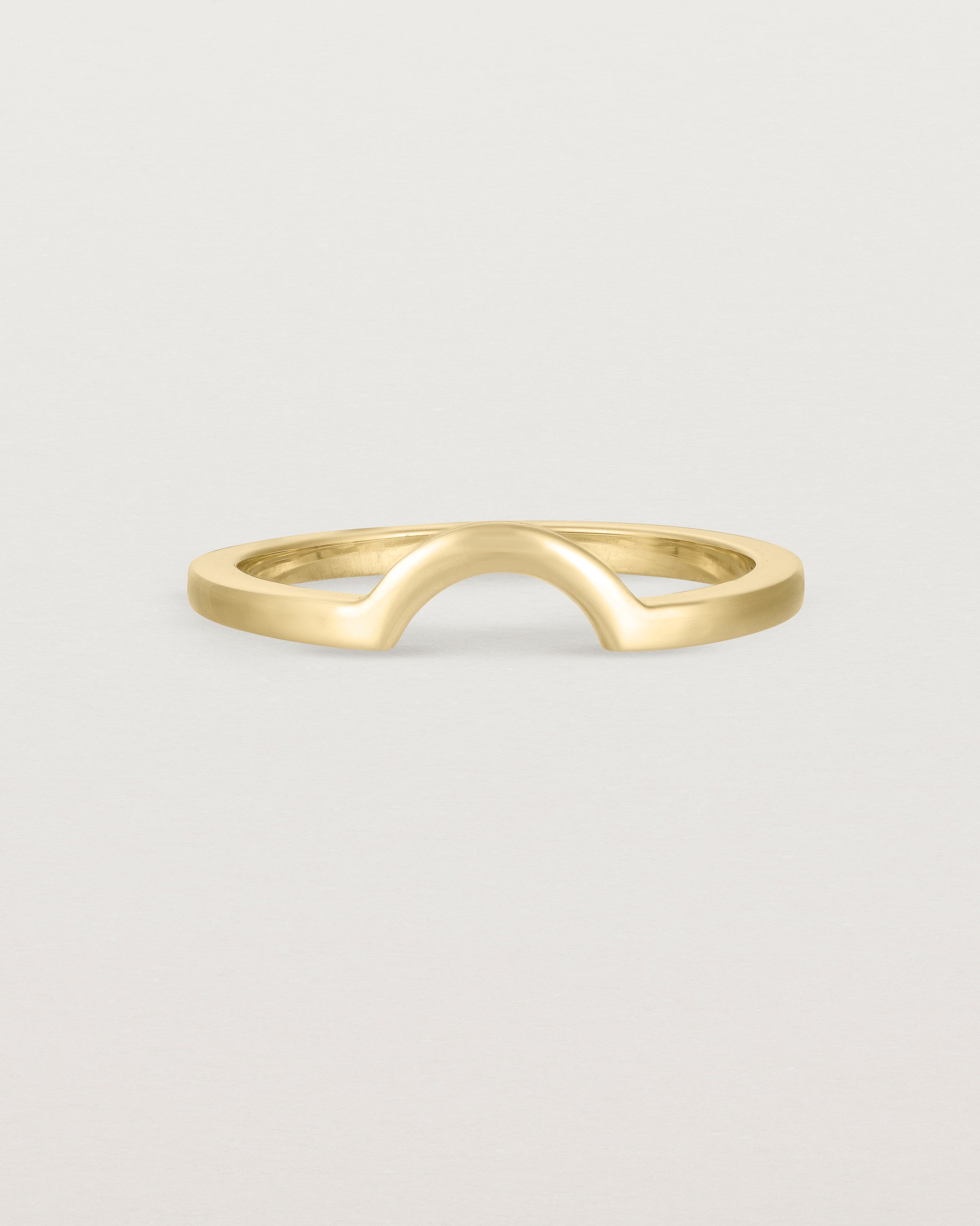 A classic small arc crown ring crafted in yellow gold