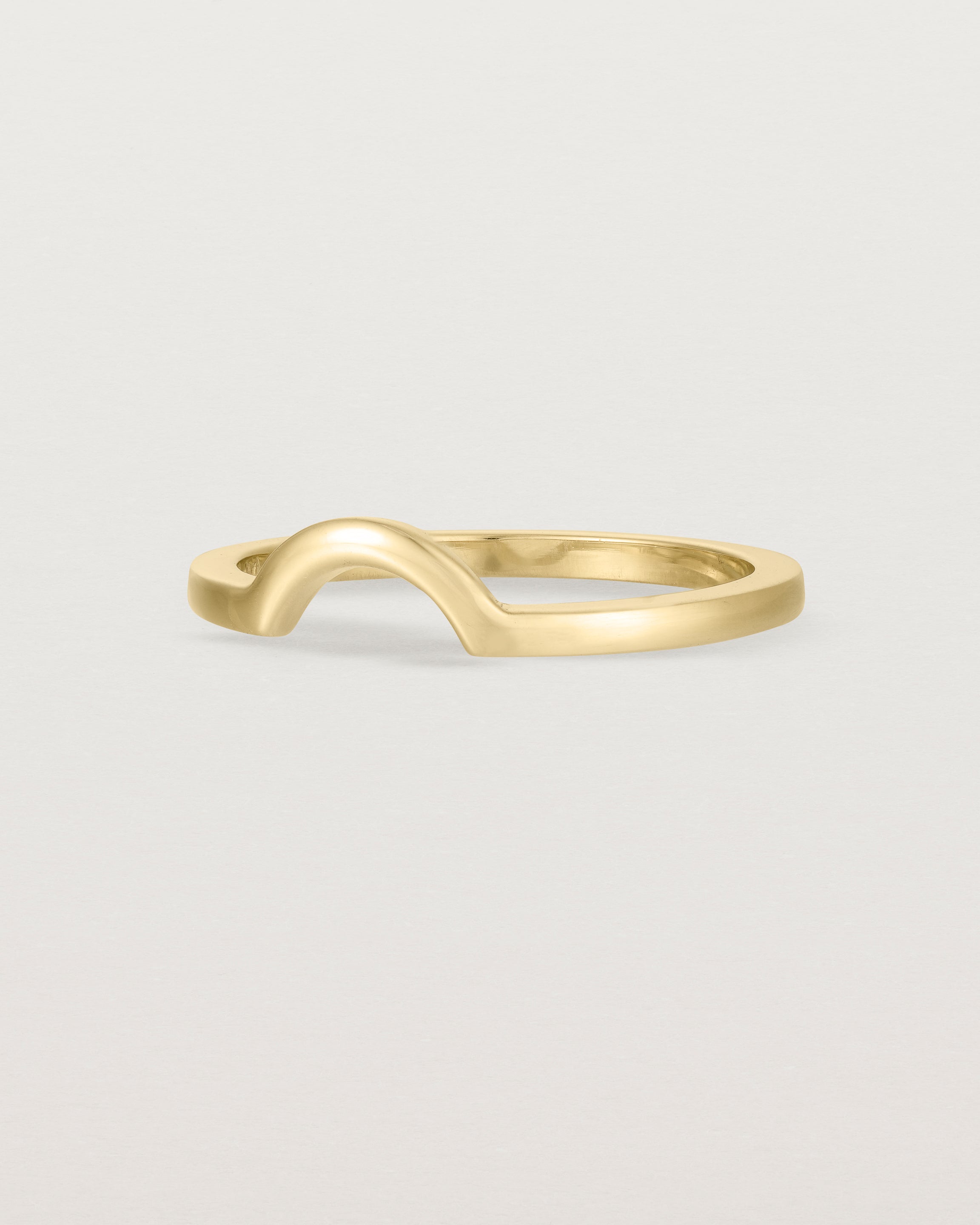 A classic small arc crown ring crafted in yellow gold
