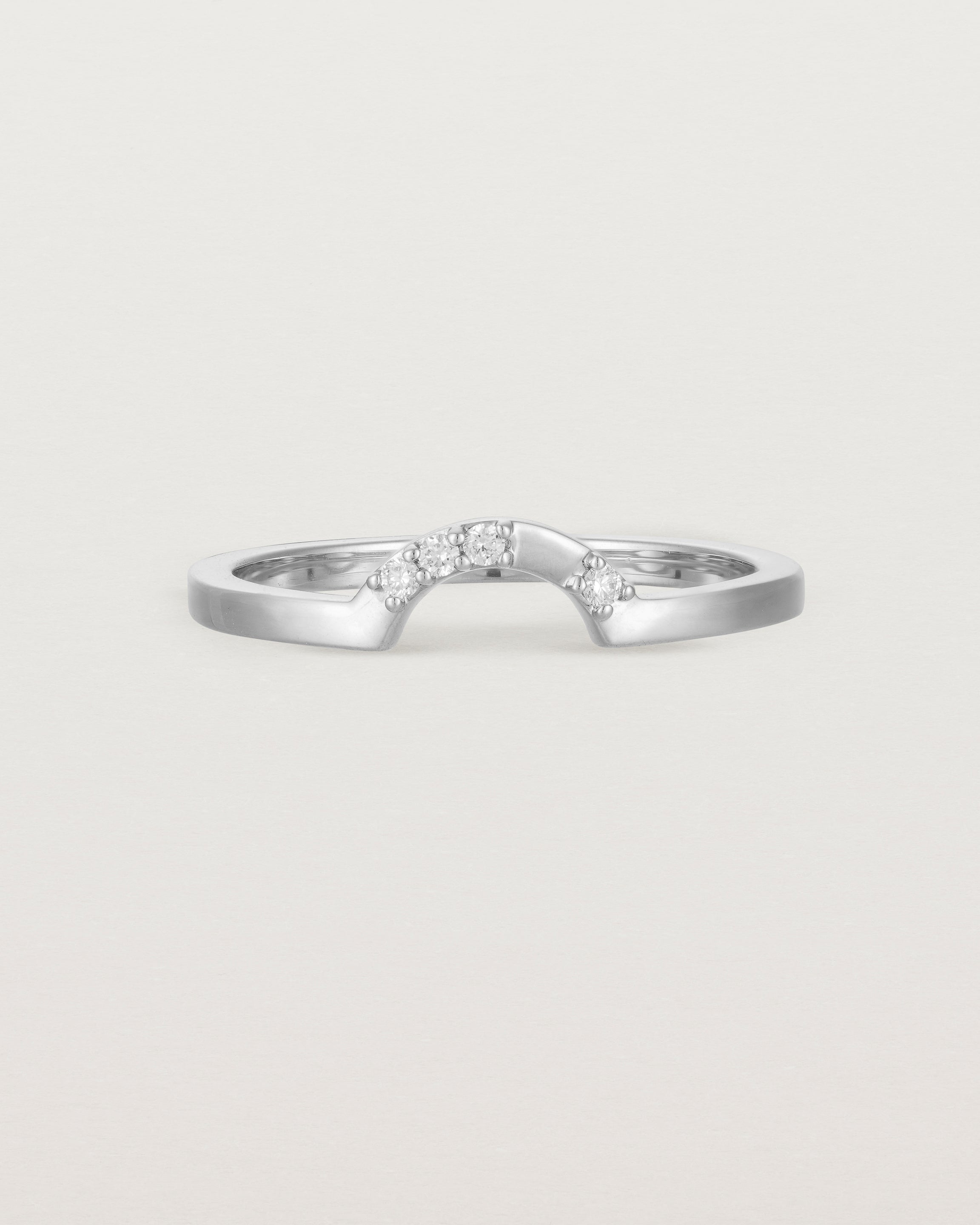 A classic small arc crown ring featuring scattered white diamonds, crafted in white gold