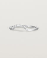 Fit three of a classic arc crown ring featuring scattered white diamonds, crafted in white gold