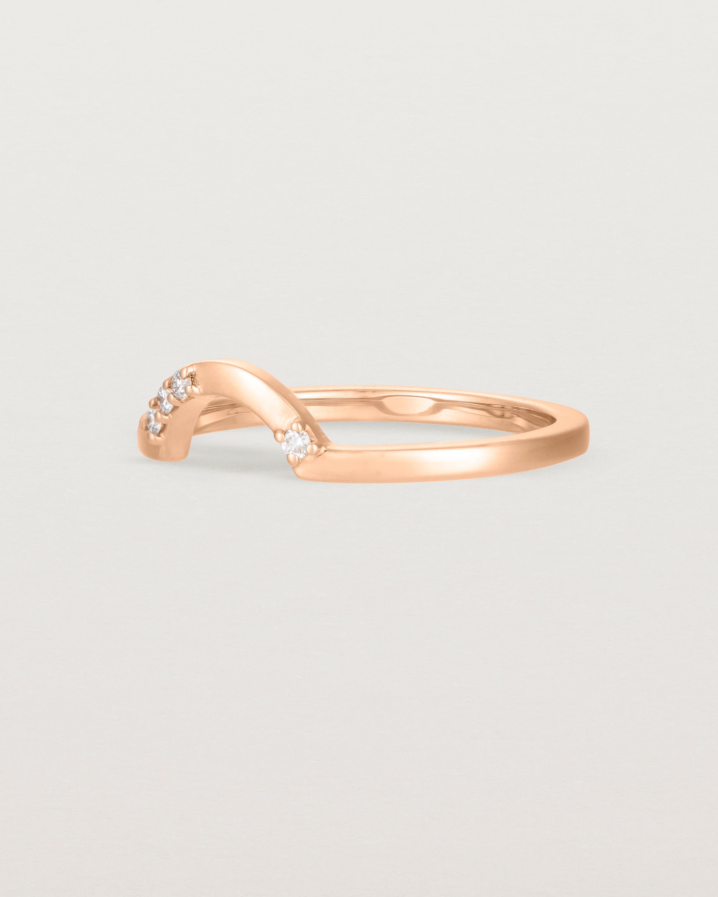 Fit two of a classic small arc crown ring featuring scattered white diamonds, crafted in rose gold