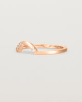 Fit two of a classic small arc crown ring featuring scattered white diamonds, crafted in rose gold