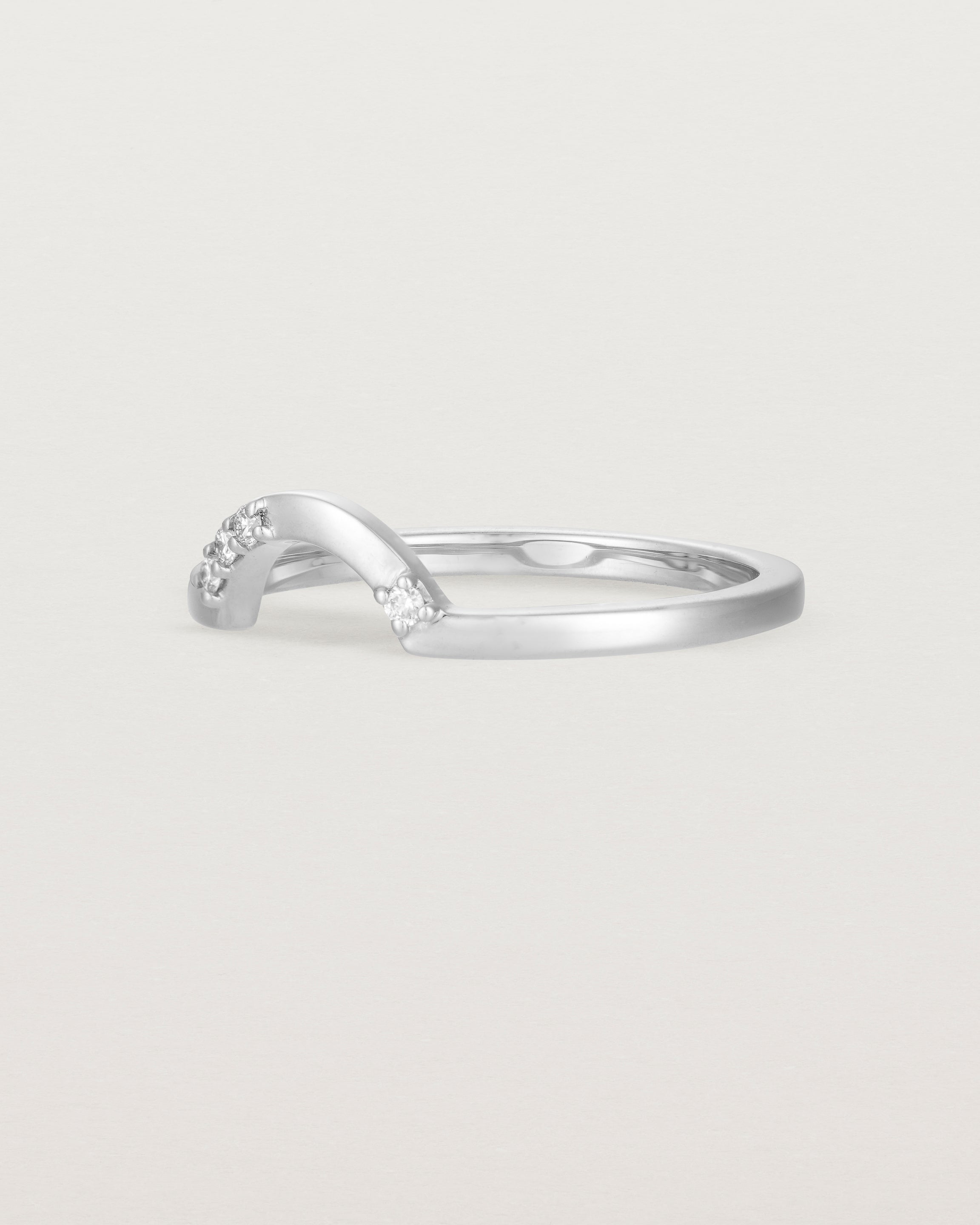 Fit two of a classic arc ring featuring scattered white diamonds, crafted in white gold