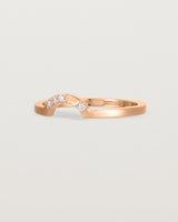 A classic small arc crown ring featuring scattered white diamonds, crafted in rose gold