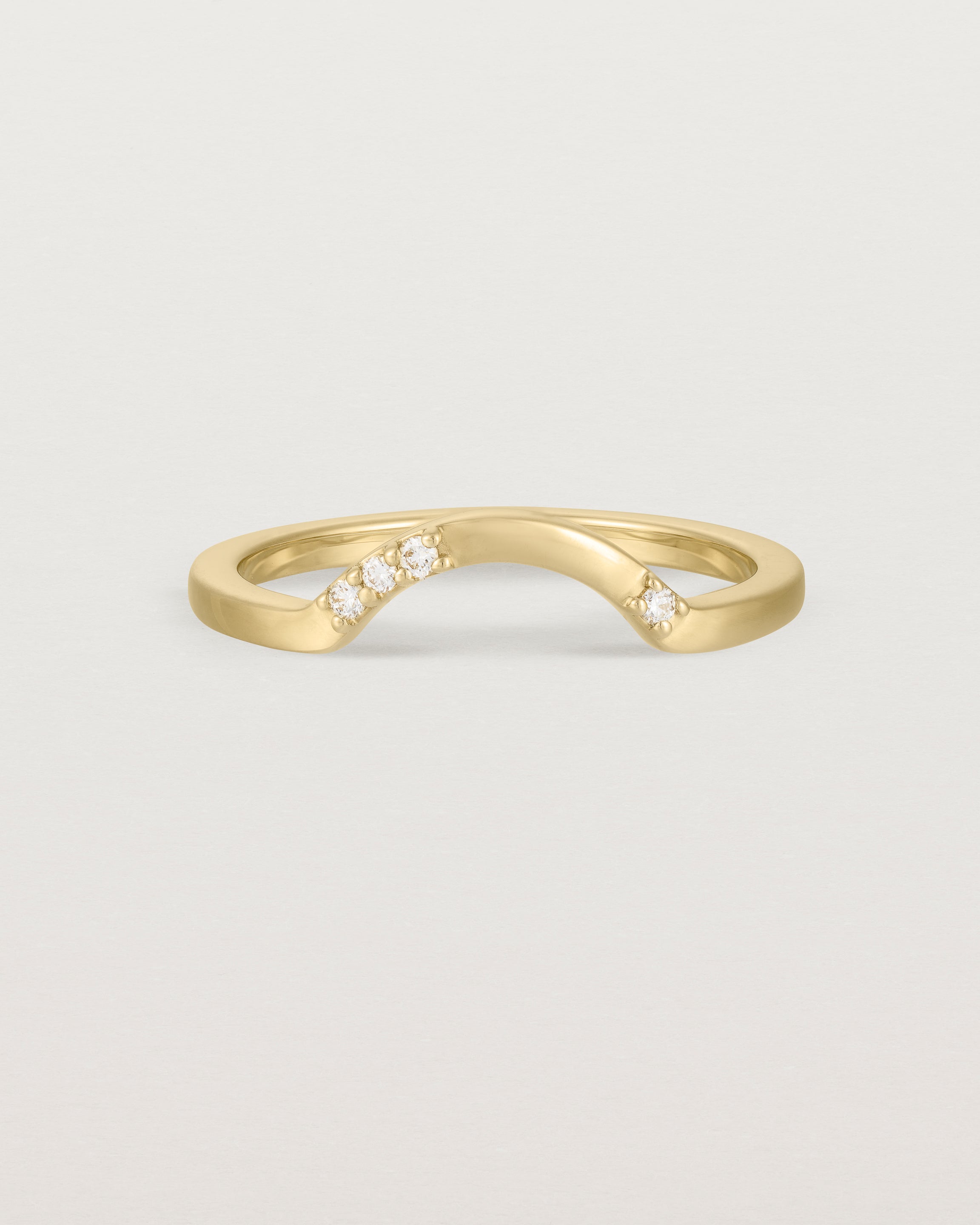 Fit four of a classic arc crown ring featuring scattered white diamonds, crafted in yellow gold