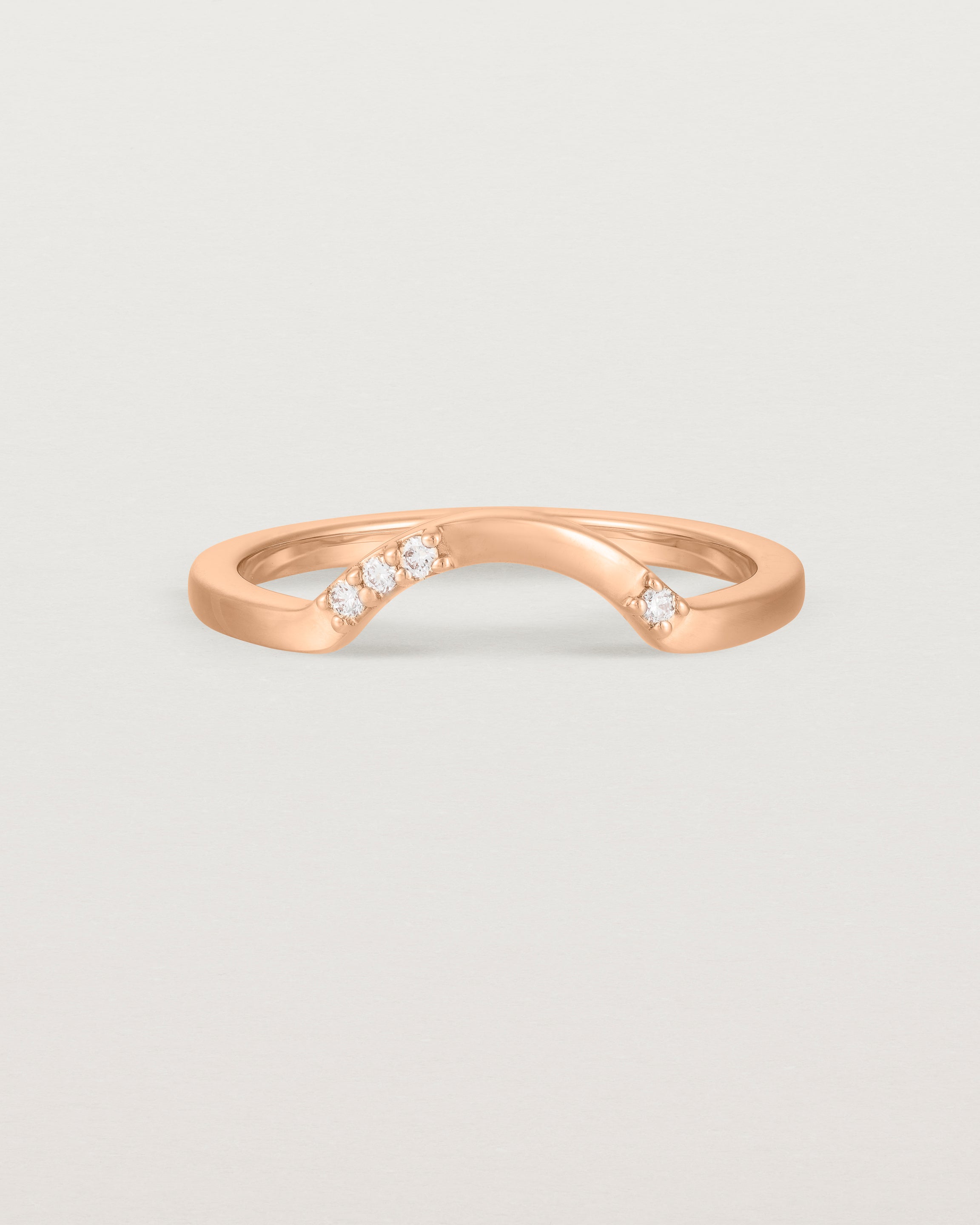 Fit four of a classic arc crown ring featuring scattered white diamonds, crafted in rose gold