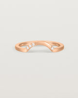 Fit four of a classic arc crown ring featuring scattered white diamonds, crafted in rose gold