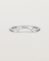Fit four of a classic arc crown ring featuring scattered white diamonds, crafted in white gold