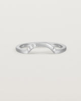 Fit four of a classic arc crown ring featuring scattered white diamonds, crafted in white gold