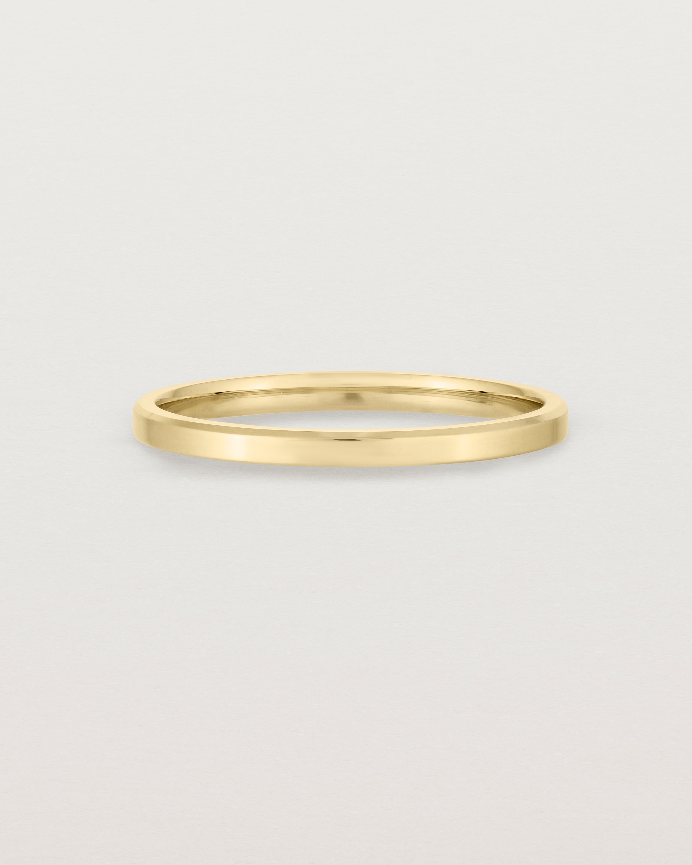 2mm yellow gold wedding band with a chamfered edge