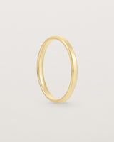 2mm yellow gold wedding band with a chamfered edge