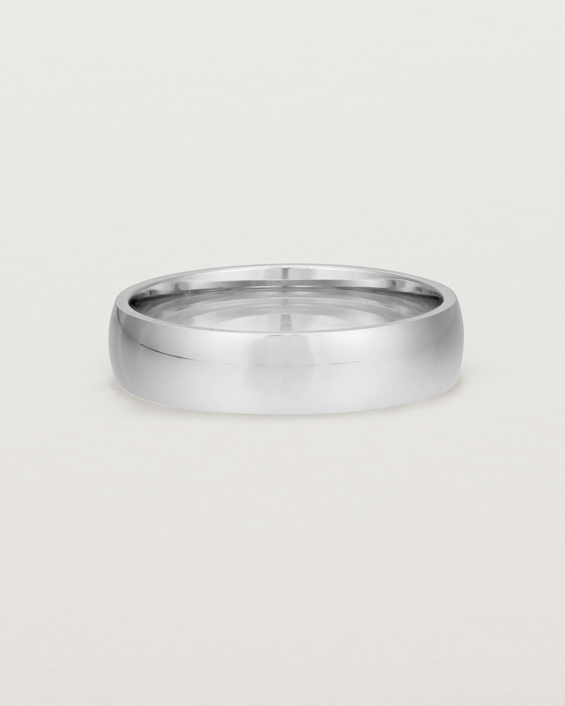 The front view of a 5mm wide heavy wedding ring in sterling silver 