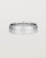 The front view of a 5mm wide heavy wedding ring in white gold. 