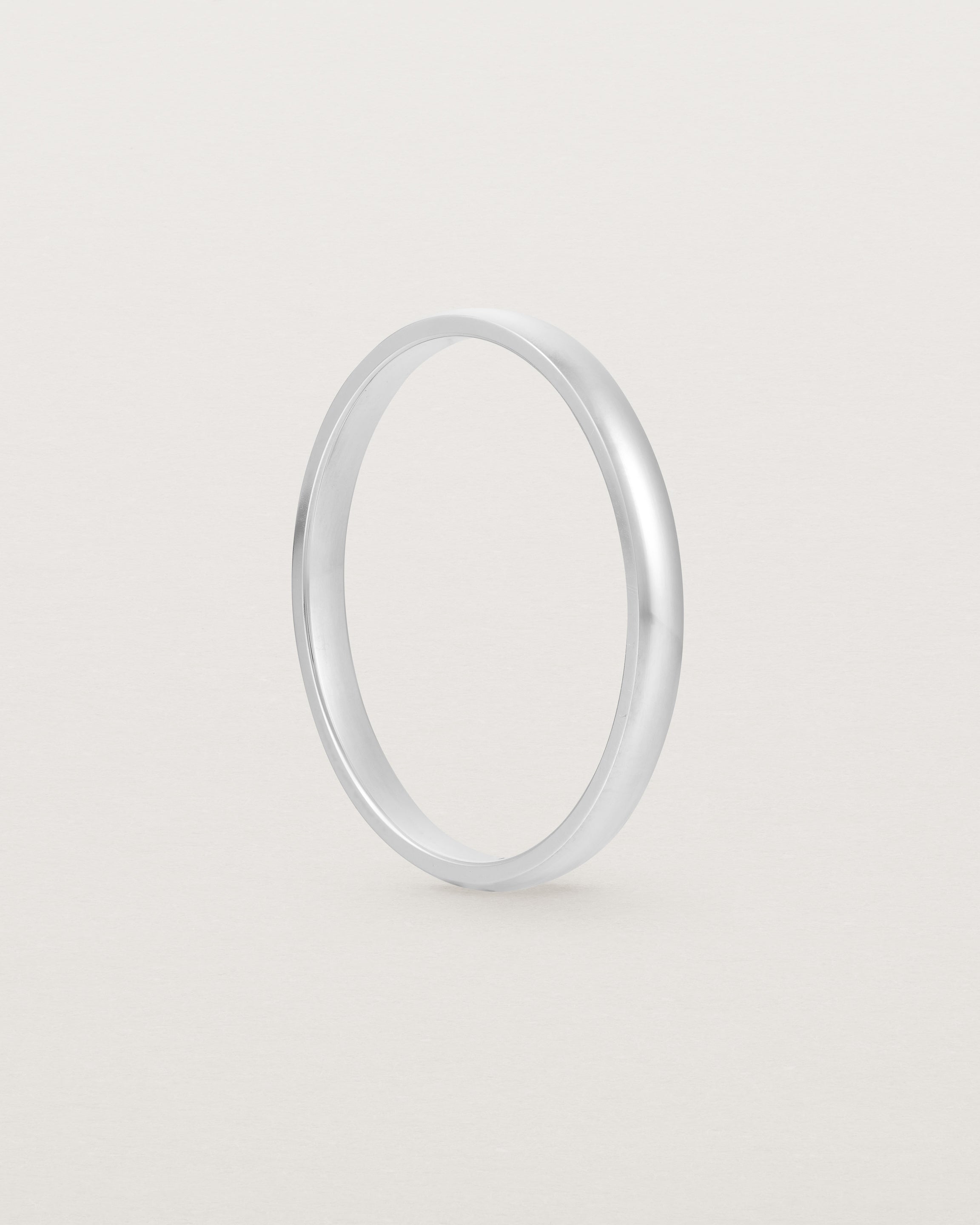 A fine, classic wedding band in white gold