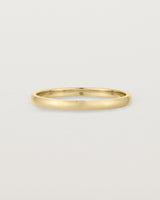 A fine, classic wedding band in yellow gold