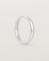 The side view of a 3mm fine, classic wedding band in sterling silver