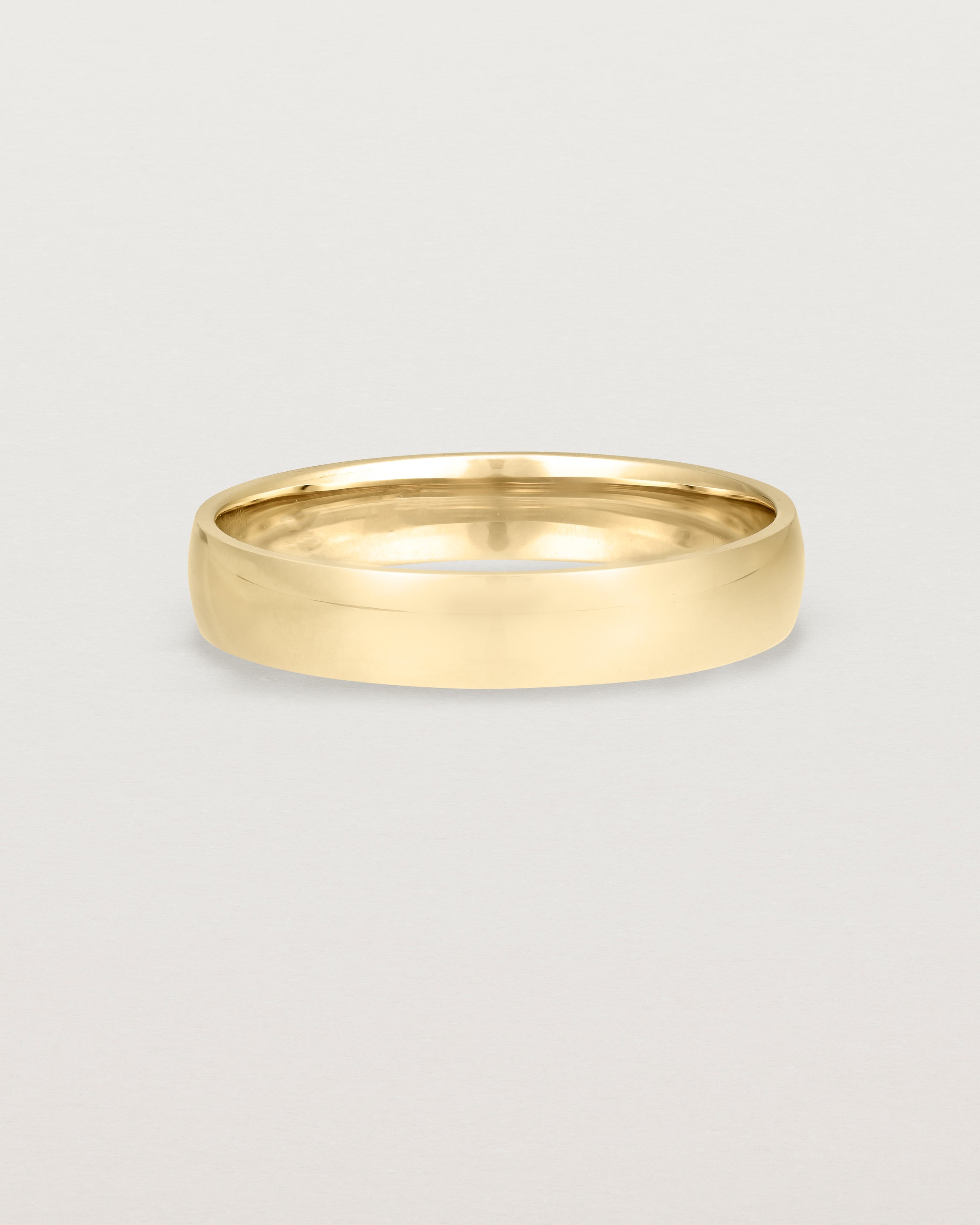 A classic 4mm wedding band crafted in yellow gold