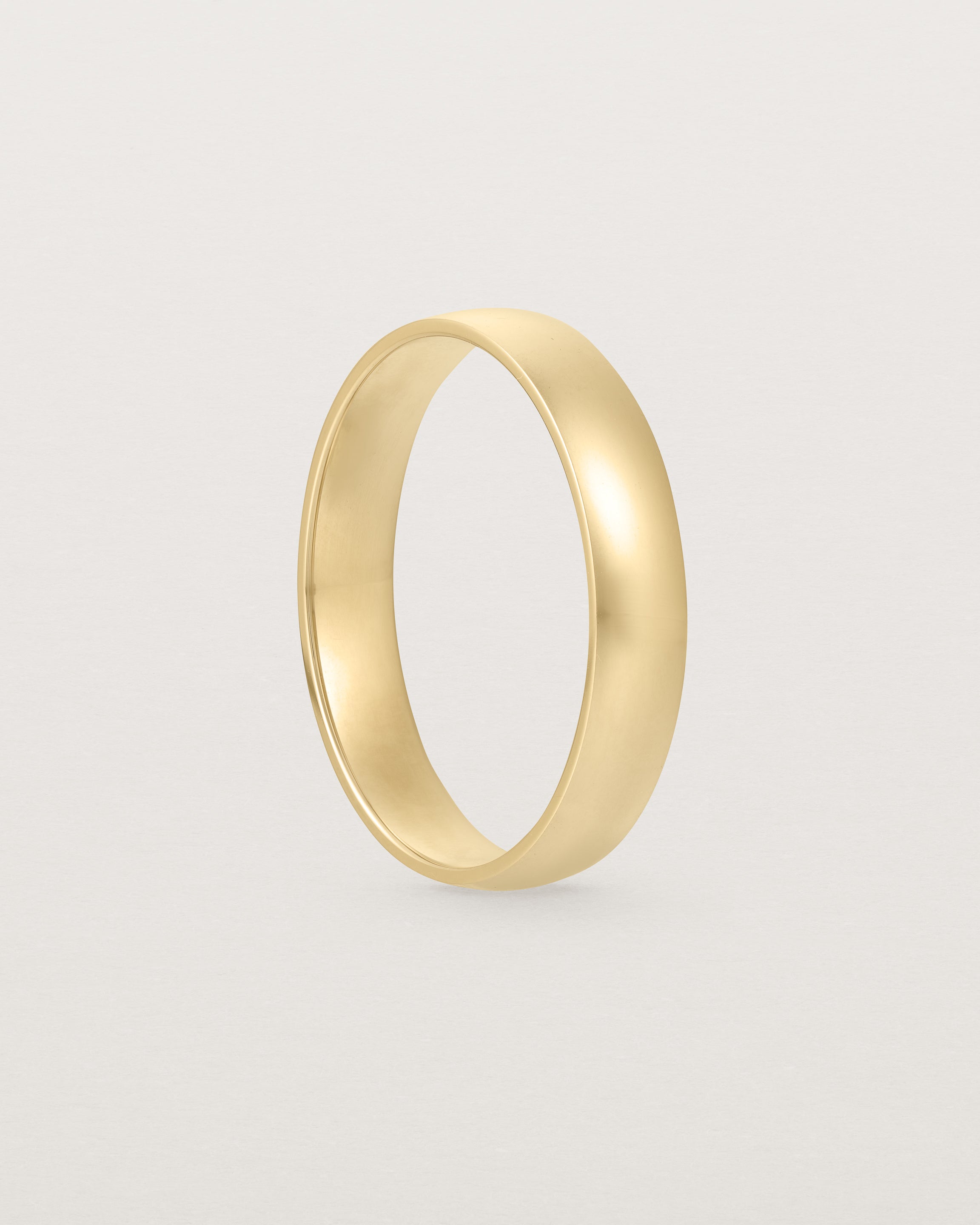 A classic 4mm wedding band crafted in yellow gold