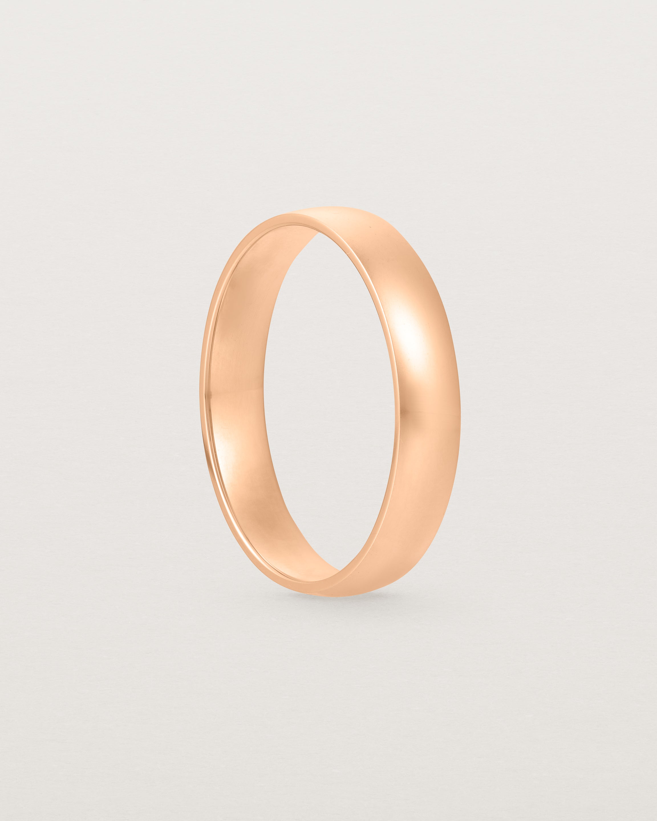 A classic 4mm wedding band crafted in rose gold