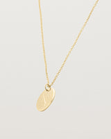 yellow gold engraved necklace with a botanical vine engraving