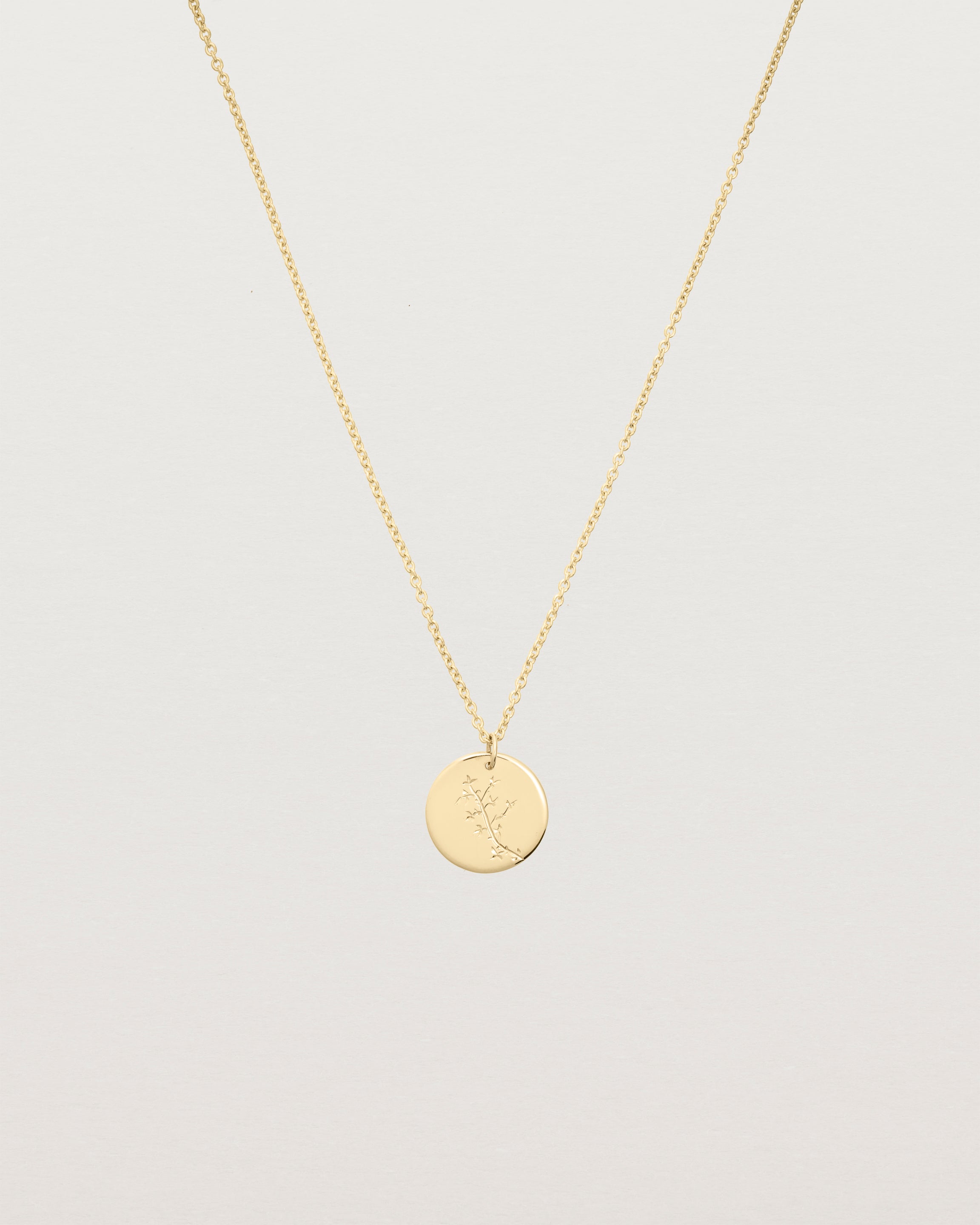 yellow gold engraved necklace with a botanical vine engraving