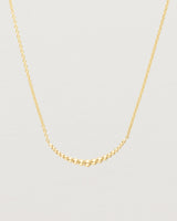 Close up of the Crescent Necklace in yellow gold.