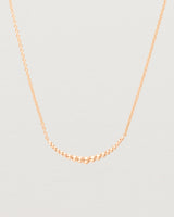 Close up view of the Crescent Necklace in Rose Gold. 