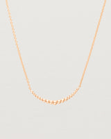 Close up view of the Crescent Necklace in Rose Gold. 